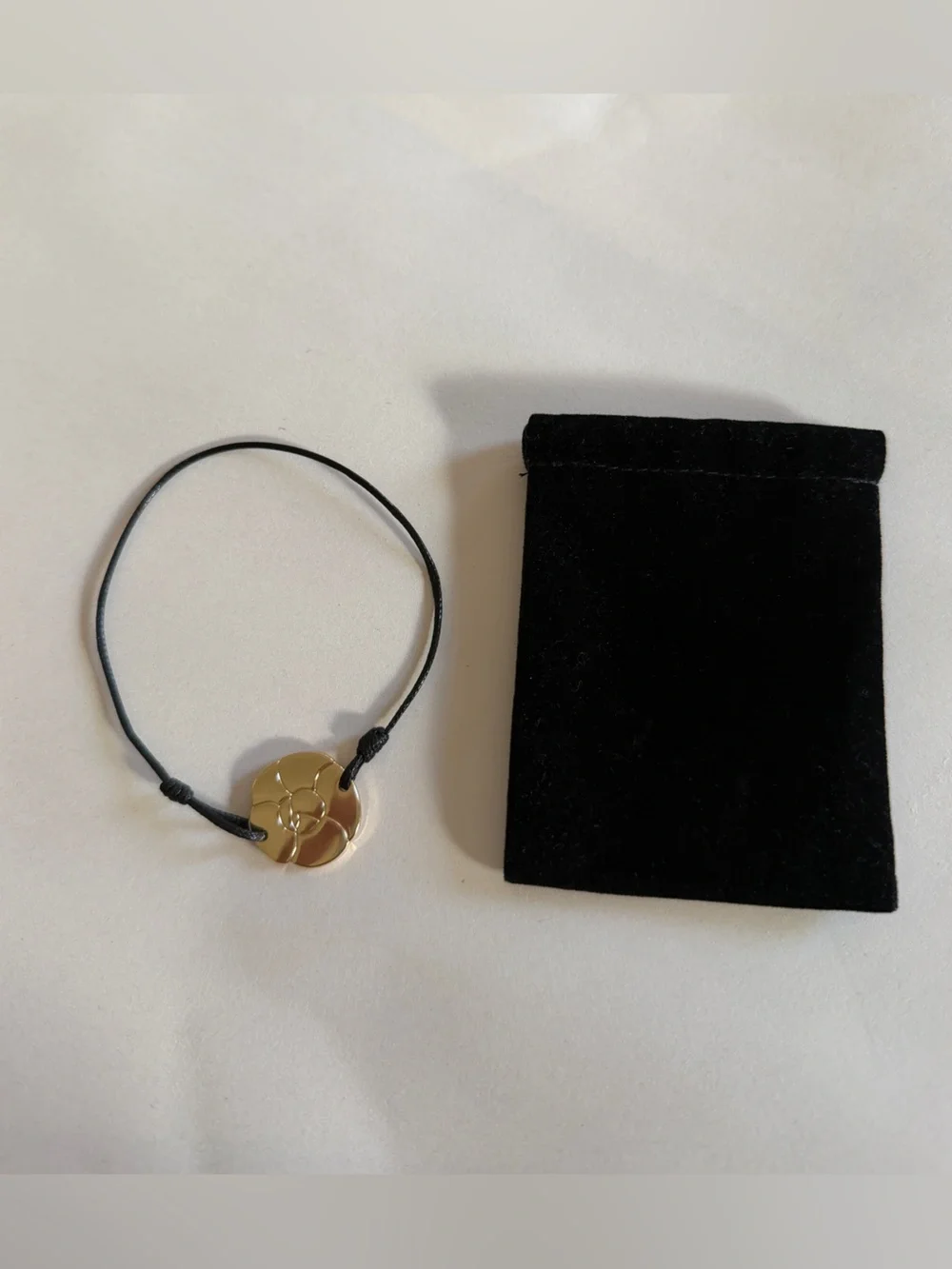 CHANEL CAMELIA CORD BRACELET